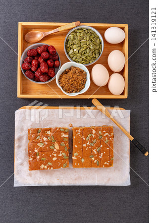 sliced jujube brown sugar cake topped with mixed nuts and seeds sliced jujube brown sugar cake topped with mixed nuts and seeds 141319121