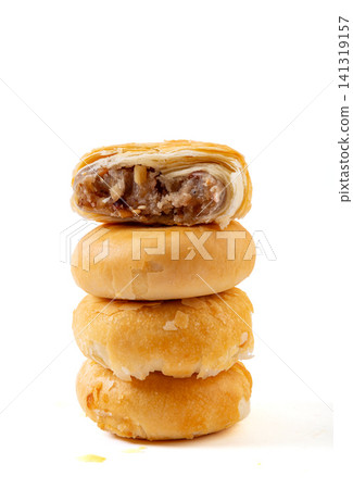 flaky Suzhou style mooncake stack showing rich mixed nuts filling flaky Suzhou style mooncake stack showing rich mixed nuts filling 141319157