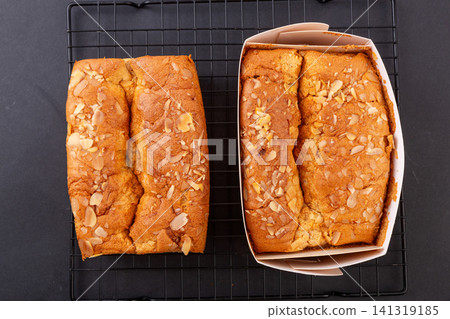 slice of golden pillow cake with red date flavor and sliced almond topping slice of golden pillow cake with red date flavor and sliced almond topping 141319185
