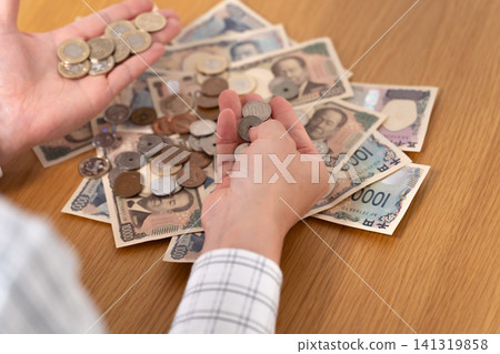 Hands counting money Hands counting money 141319858