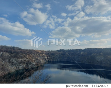 Flooded granite quarry. Beautiful landscape of a flooded granite quarry. Flooded granite quarry. Beautiful landscape of a flooded granite quarry. 141320023
