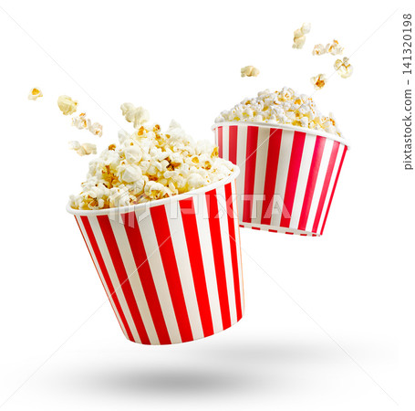 Popcorn in red and white striped box and flying out grains isolated on white or transparent background Popcorn in red and white striped box and flying out grains isolated on white or transparent background 141320198