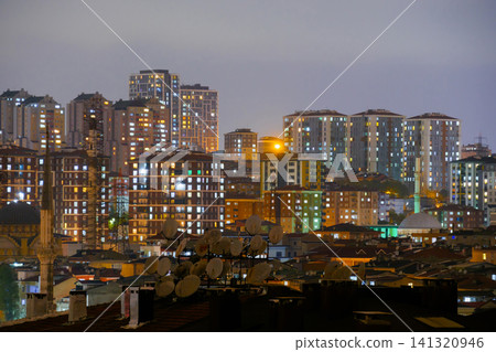 View of turkish residential buildings with fast illuminated windows at night 141320946