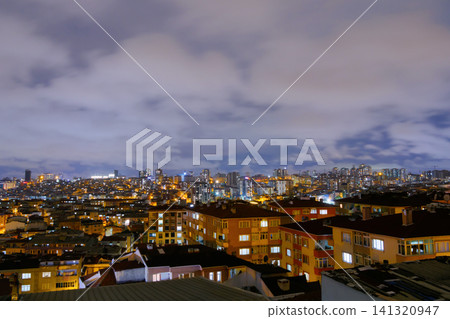 View of cloudy sky over living apartment building in Turkey at night 141320947