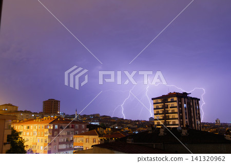 View of stormy sky with lightning strikes over the city of Istanbul at night View of stormy sky with lightning strikes over the city of Istanbul at night 141320962