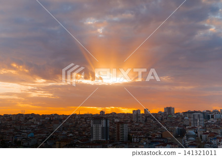 Dramatic sunset sky with the setting sun and clouds over the city, Istanbul Dramatic sunset sky with the setting sun and clouds over the city, Istanbul 141321011