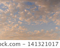 View of warm sunset clouds in the evening sky. 141321017