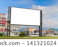 Mock up: white billboard or large display against moving car traffic 141321024