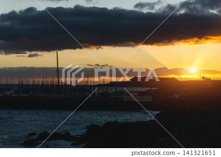 beautiful sunset at ocean coast of Golf de Sur, Tenerife, Canary island beautiful sunset at ocean coast of Golf de Sur, Tenerife, Canary island 141321651