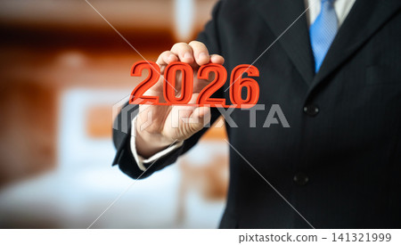 The year 2026 in the hand of a businessman. Business plans and economic forecasts. Strategic vision, market expectations and financial planning. Corporate strategy content, investment and future trend The year 2026 in the hand of a businessman. Business plans and economic forecasts. Strategic vision, market expectations and financial planning. Corporate strategy content, investment and future trend 141321999