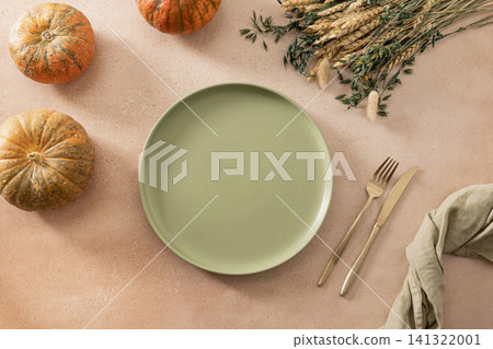 Autumn table setting with empty sage green plate Autumn table setting with empty sage green plate 141322001