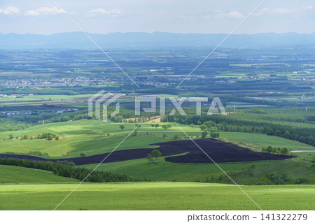 A magnificent summer panoramic view of the Tokachi Plain from Naitai Plateau Ranch in Kamishihoro Town, Hokkaido. A magnificent summer panoramic view of the Tokachi Plain from Naitai Plateau Ranch in Kamishihoro Town, Hokkaido. 141322279