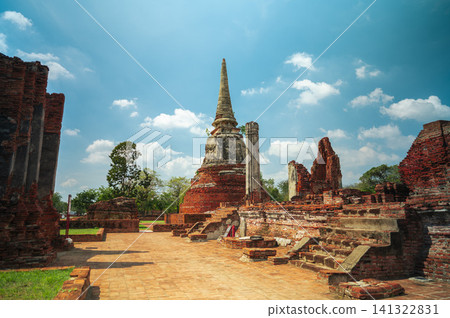 Ancient headless Buddha statues lining the red brick wall at Wat Mahathat in Ayutthaya, Thailand. Ancient headless Buddha statues lining the red brick wall at Wat Mahathat in Ayutthaya, Thailand. 141322831