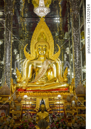Golden Buddha sculpture sitting in spectacular mirror hall with silver glass pillars, Thailand landmark. Golden Buddha sculpture sitting in spectacular mirror hall with silver glass pillars, Thailand landmark. 141322914