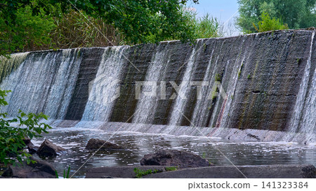 Dam.Power stream of clean water.Waterfall,spa,pool Dam.Power stream of clean water.Waterfall,spa,pool 141323384