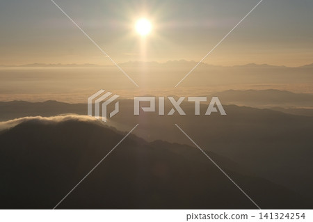 A magnificent sea of clouds illuminated by the rising sun, with layers upon layers of mountain ranges visible at dawn. A magnificent sea of clouds illuminated by the rising sun, with layers upon layers of mountain ranges visible at dawn. 141324254