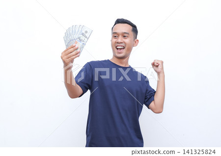 Man holds money, eyes wide, mouth open in surprise. He gestures with free hand, showing excitement. Pure white background emphasizes his reaction. Ideal for finance, unexpected gains, or lucky moments Man holds money, eyes wide, mouth open in surprise. He gestures with free hand, showing excitement. Pure white background emphasizes his reaction. Ideal for finance, unexpected gains, or lucky moments 141325824