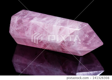 Macro mineral pink quartz crystal on a black background Macro mineral pink quartz crystal on a black background 141326308