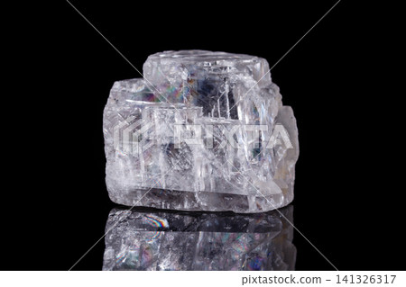 Macro mineral stone Iceland spar on black background Macro mineral stone Iceland spar on black background 141326317
