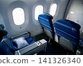 Warsaw, Poland, May 10 2018: Premium economy seat with blanket and pillow prepared for passengers 141326340