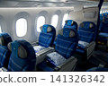 Warsaw, Poland, May 10 2018: View through premium economy cabin towards economy class on a flight to the USA 141326342