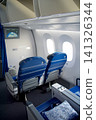 Warsaw, Poland, May 10 2018: Premium economy seat with blanket and pillow prepared for passengers 141326344