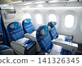 Warsaw, Poland, May 10 2018: View through premium economy cabin towards economy class on a flight to the USA 141326345