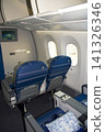 Warsaw, Poland, May 10 2018: Premium economy seat with blanket and pillow prepared for passengers 141326346