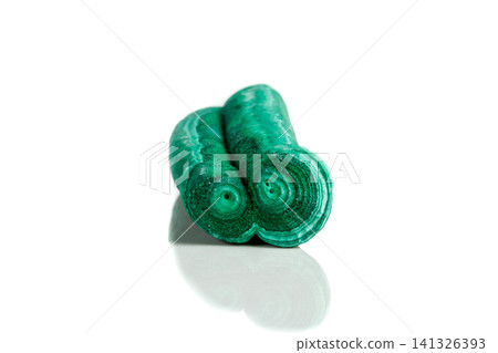 Macro mineral stone malachite stalactite on white background Macro mineral stone malachite stalactite on white background 141326393