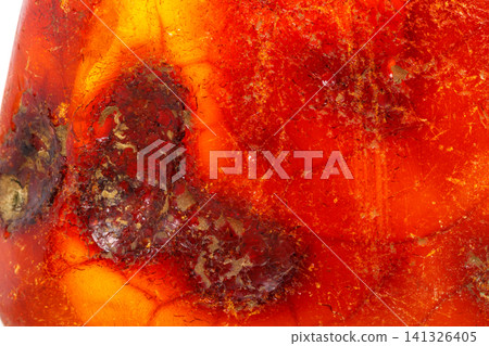 Macro Amber mineral stone on white background 141326405
