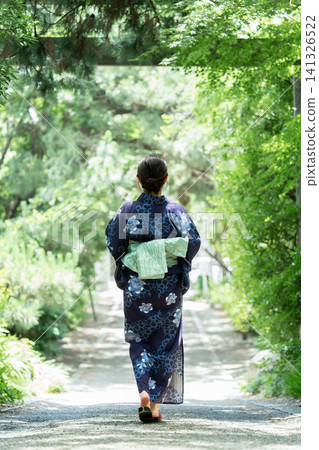 Japanese summer: Japanese women in yukata walking along a shrine approach. Japanese summer: Japanese women in yukata walking along a shrine approach. 141326522