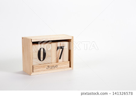 Wooden calendar June 07 on a white background Wooden calendar June 07 on a white background 141326578
