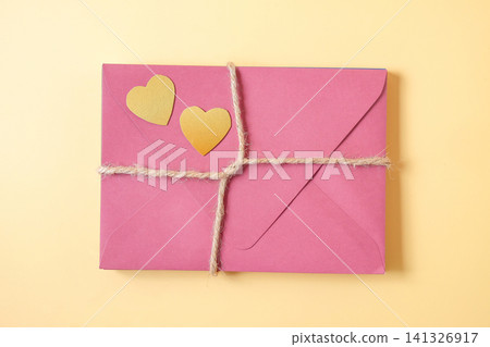 A Stack of Color envelopes tie with hemp rope on background. A Stack of Color envelopes tie with hemp rope on background. 141326917