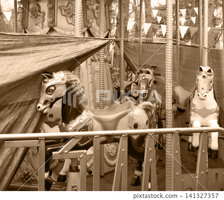 White ponies on an abandoned carousel White ponies on an abandoned carousel 141327357
