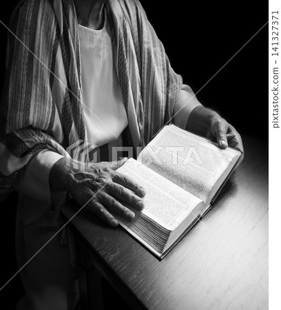 Old man reading a big book Old man reading a big book 141327371