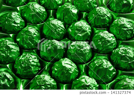 Golden candies in a big box Golden candies in a big box 141327374