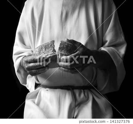 Man's hans holding fresh bread Man's hans holding fresh bread 141327376