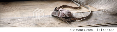 Old sling with a stone Old sling with a stone 141327382
