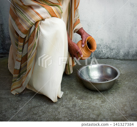 Man pour water into bowl Man pour water into bowl 141327384