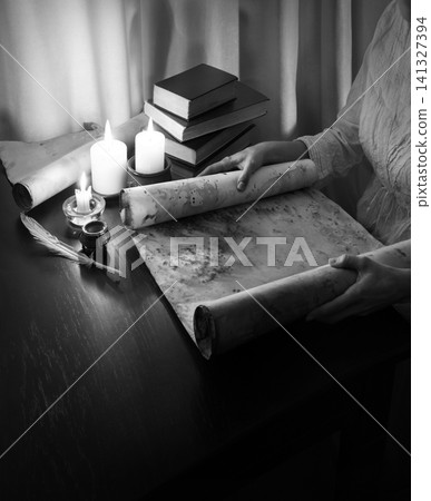 Hands with an old scroll Hands with an old scroll 141327394