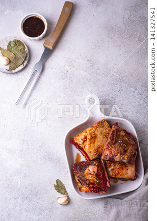 Raw unkooked lamb ribs for barbecue Raw unkooked lamb ribs for barbecue 141327541