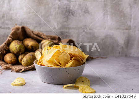 Crispy fresh potato chips, junk food 141327549