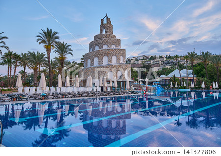 Bodrum, Turkey -June 4 2026: Selectum collection Bodrum is a 5 star all inclusive resort located in Akyarlar Turkey . Picture showing the prominent tower structure at the main pool area, Daylight shot Bodrum, Turkey -June 4 2026: Selectum collection Bodrum is a 5 star all inclusive resort located in Akyarlar Turkey . Picture showing the prominent tower structure at the main pool area, Daylight shot 141327806