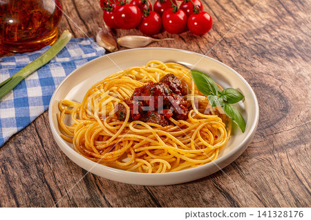 Spaghetti meatballs dish on wooden table, fresh ingredients, rustic Italian cuisine Spaghetti meatballs dish on wooden table, fresh ingredients, rustic Italian cuisine 141328176