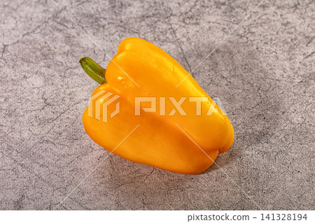 Yellow bell pepper on textured gray surface Yellow bell pepper on textured gray surface 141328194
