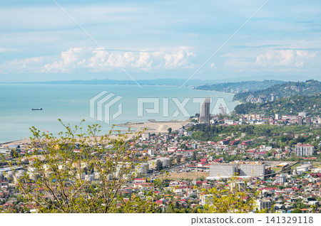 Panoramic urban skyline with coastal horizon seen from hilltop point. Panoramic urban skyline with coastal horizon seen from hilltop point. 141329118