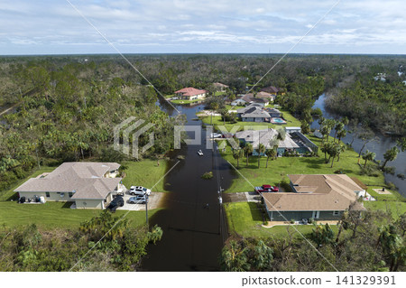 Aftermath of natural disaster. Flooded houses by hurricane Ian rainfall in Florida residential area Aftermath of natural disaster. Flooded houses by hurricane Ian rainfall in Florida residential area 141329391