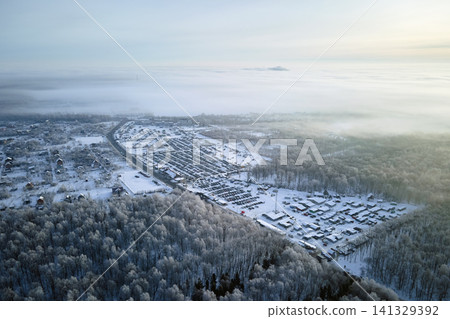 Aerial view of vehicle open market lot with many cars for sale parked and people customers walking in winter Aerial view of vehicle open market lot with many cars for sale parked and people customers walking in winter 141329392