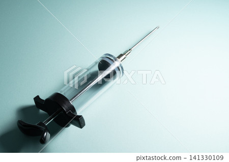 The image of medical care and hygiene conveyed by a transparent syringe. The image of medical care and hygiene conveyed by a transparent syringe. 141330109