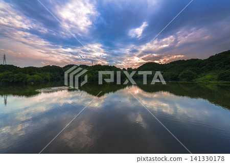 Summer 2026, Nara Nunome Dam: Sunset sky reflected on the lake surface; the sunset sky peeking through the clouds and its beautiful reflection on the lake surface ⑥ Summer 2026, Nara Nunome Dam: Sunset sky reflected on the lake surface; the sunset sky peeking through the clouds and its beautiful reflection on the lake surface ⑥ 141330178